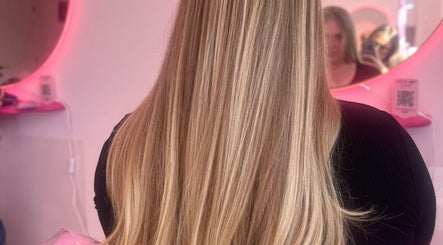 Long blonde hair styled sleekly at Hair by Susie Hancock, Ferndown, England, GB salon.