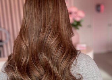 Elegant brown hair styled in waves at Hair by Susie Hancock, Ferndown, England, GB.