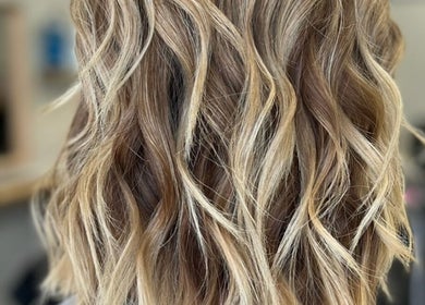 Blonde wavy highlights at Hair by Susie Hancock, Ferndown, England, GB.