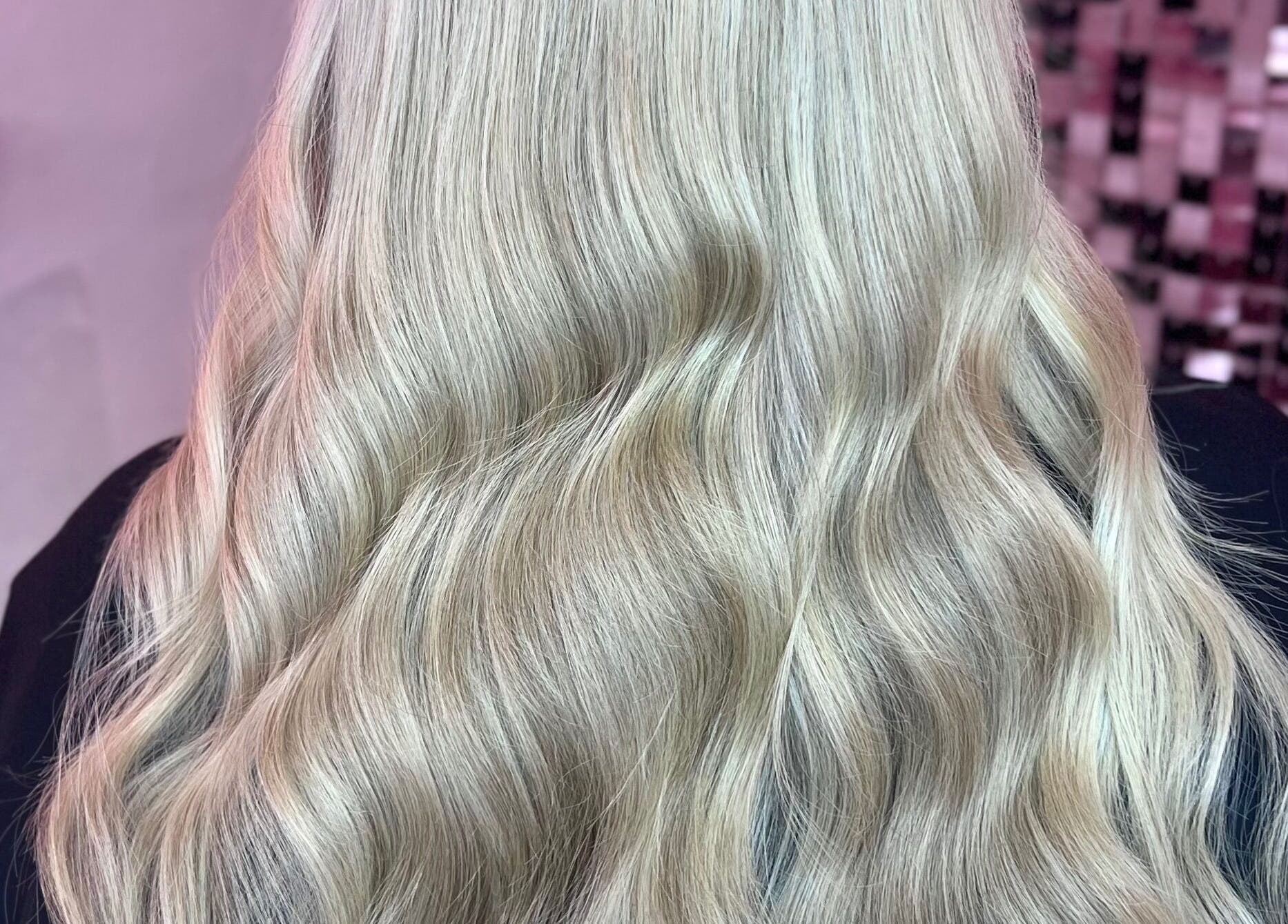 Blonde waves styled at Hair by Susie Hancock in Ferndown, England, GB, showcasing expert hair artistry.