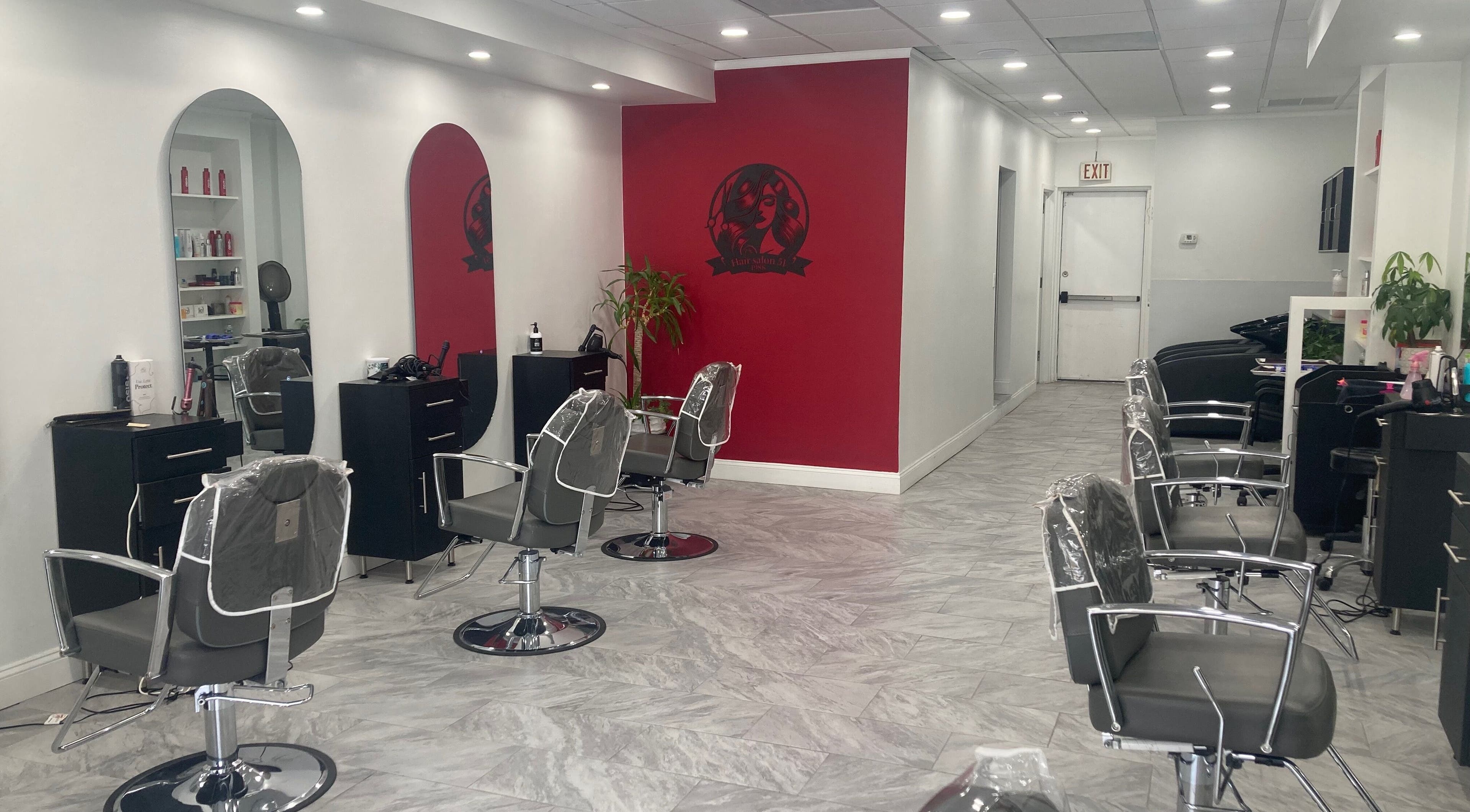 Modern interior of Hair Salon 51 featuring styling chairs and mirrors in Hicksville, New York, US.