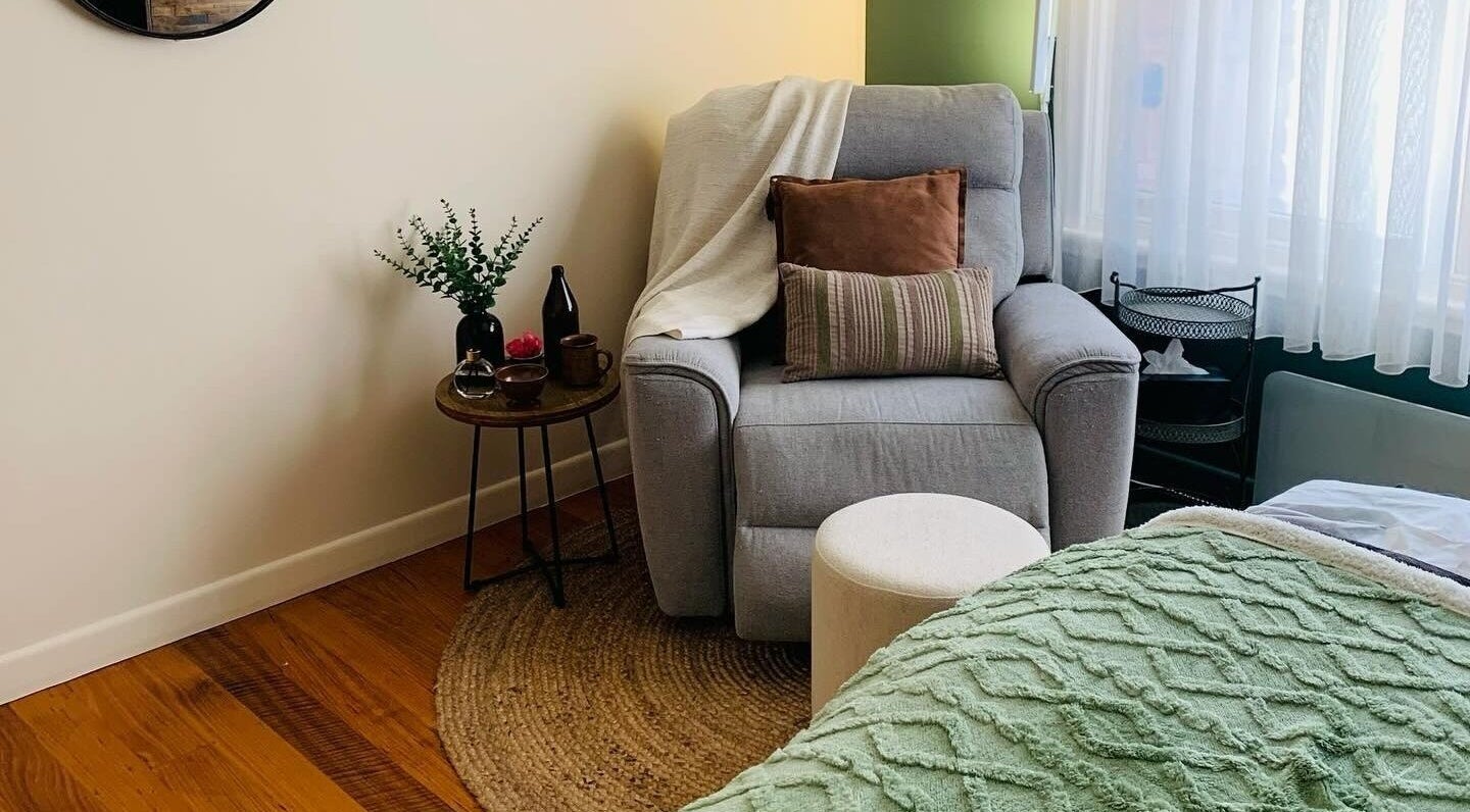 Inviting lounge chair in Remedy Massage Studio by June, Bentleigh East, Victoria, AU with relaxing decor.