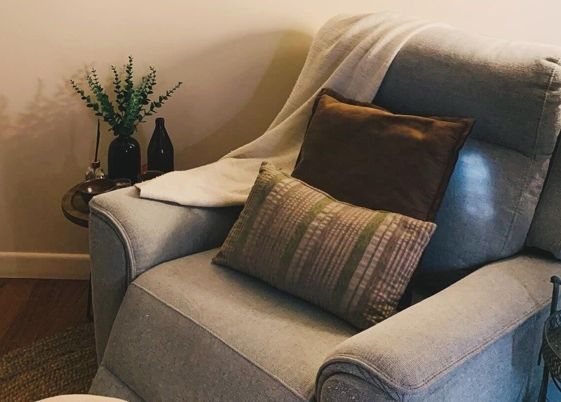Relaxing seating area at Remedy Massage Studio by June, Bentleigh East, Victoria, AU with plush cushions.