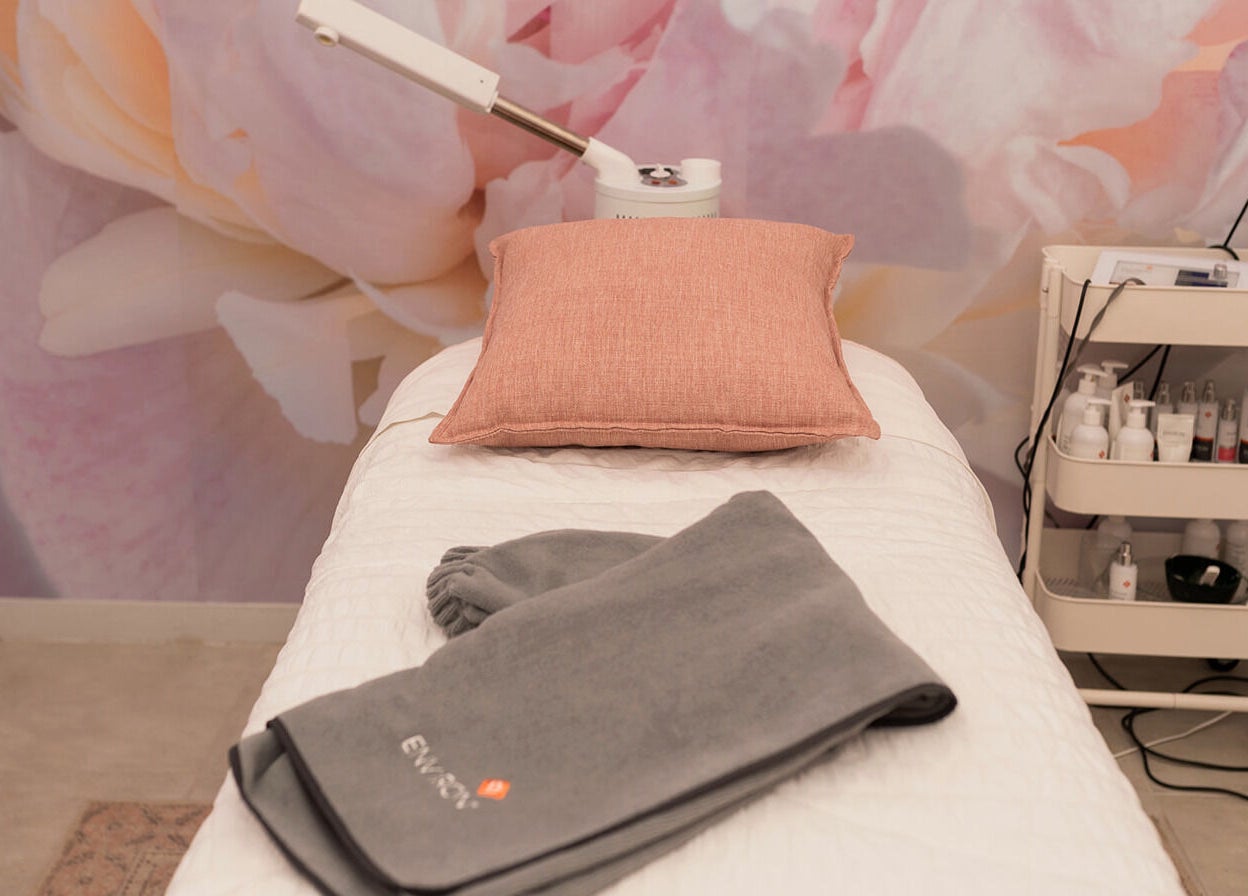 Cozy treatment bed with soft linens at Bloom by Shay in Kloof, Kwazulu-natal, ZA, offering ultimate relaxation.