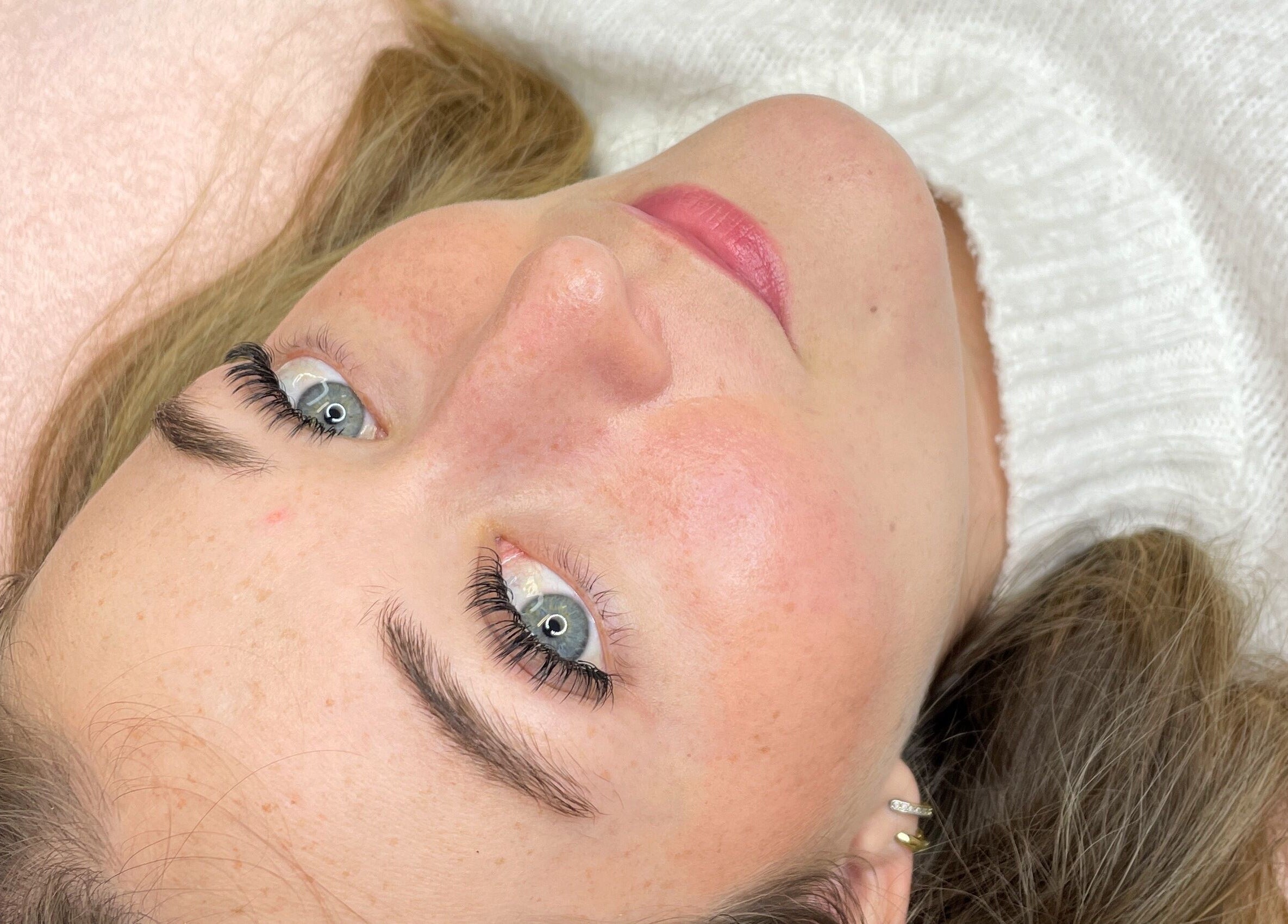 Close-up of a woman with glowing skin and vivid eyes at Bloom by Shay, Kloof, Kwazulu-natal, ZA.