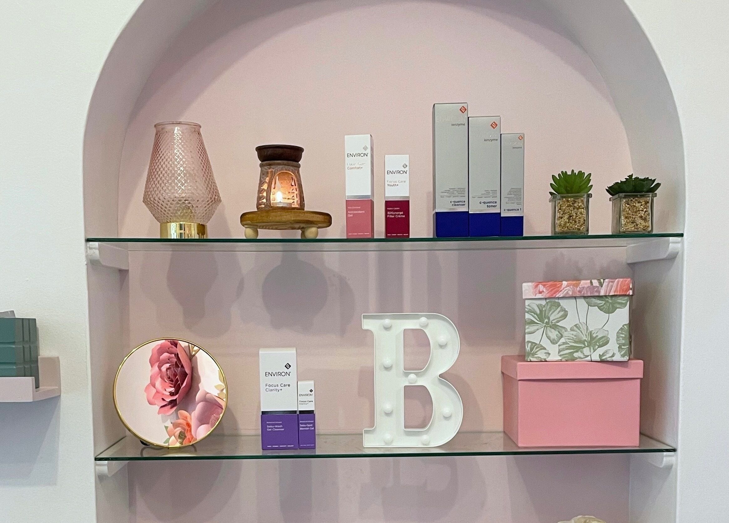 Stylish display shelf at Bloom by Shay, Kloof, Kwazulu-natal, ZA showcasing beauty products and decor.