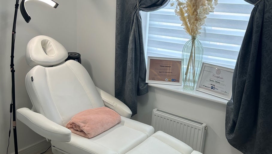 Relaxing treatment chair at TC SKIN CARE BEAUTY in Houghton Regis, England, GB with elegant decor and certificates.