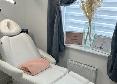 Relaxing treatment chair at TC SKIN CARE BEAUTY in Houghton Regis, England, GB with elegant decor and certificates.