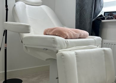 Elegant white treatment chair at TC SKIN CARE BEAUTY, Houghton Regis, England, GB, offering comfort and relaxation.