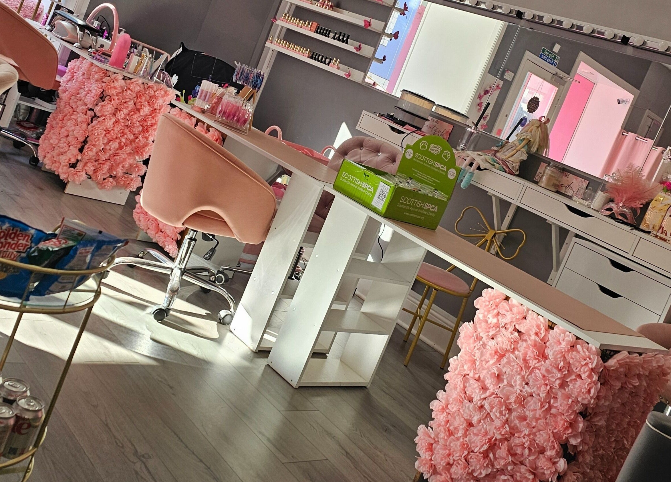 Chic beauty lounge with pink floral decor at Scrunch.N.Curl, Dundee, Scotland, GB.