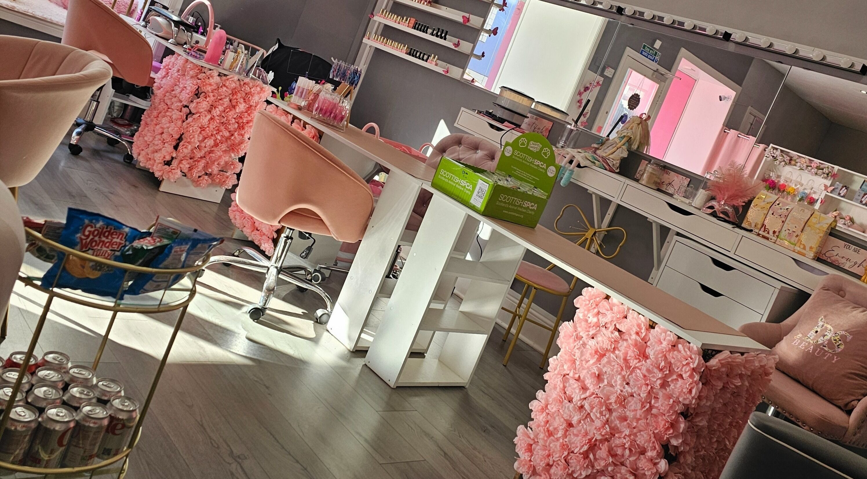 Chic beauty lounge with pink floral decor at Scrunch.N.Curl, Dundee, Scotland, GB.