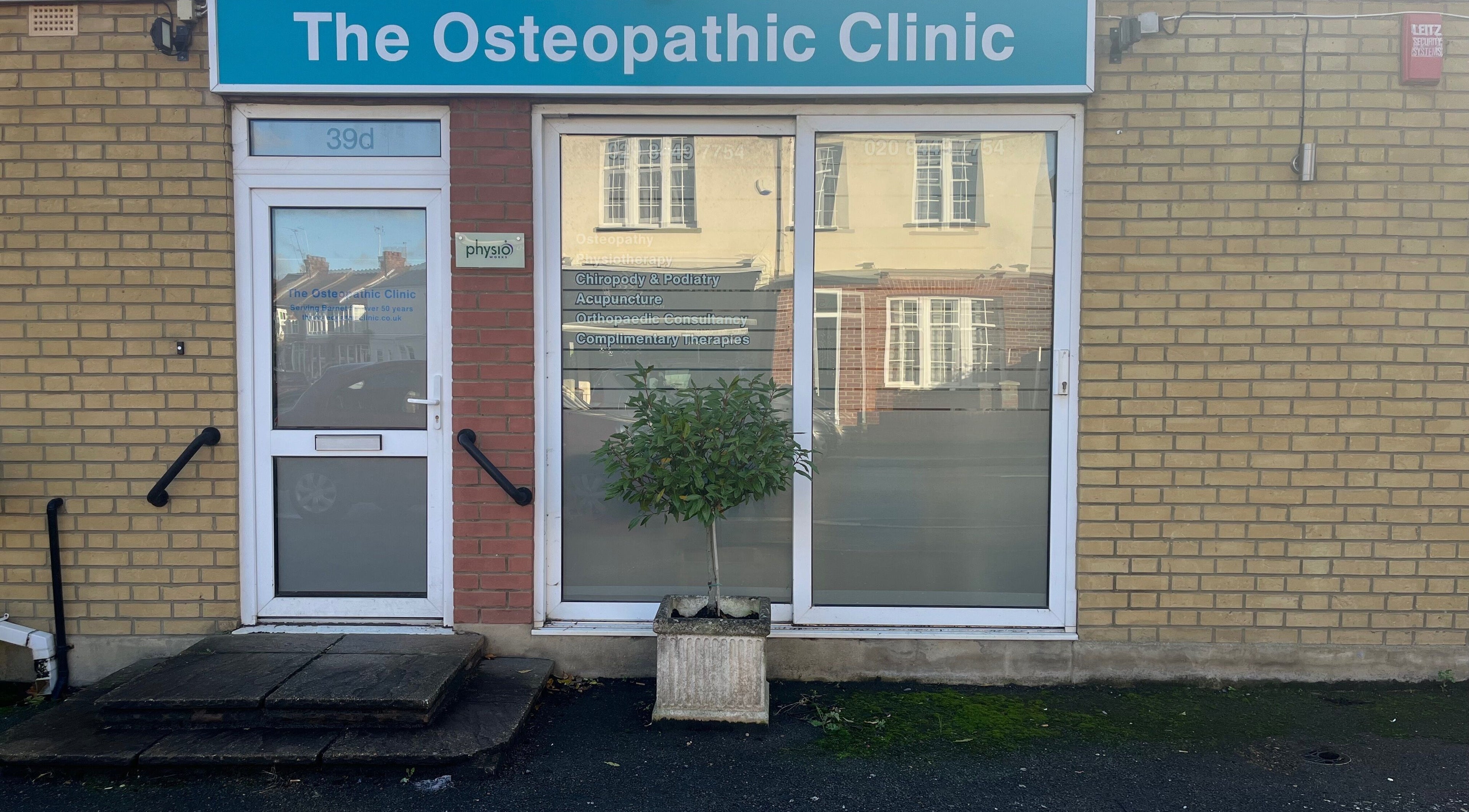 Entrance of New Barnet Chiropody Clinic in New Barnet, England with osteopathy signage.