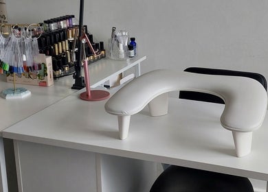 Sophisticated nail workspace at Sophie Ward Nail Artist in Walmer, England, GB, showcasing colorful polish options.