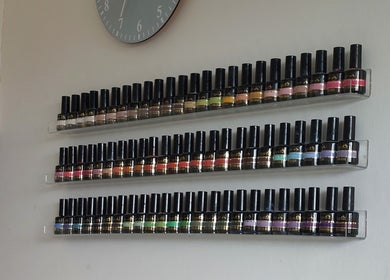 Colorful nail polish shelves at Sophie Ward Nail Artist in Walmer, England, GB, showcasing a stylish selection.