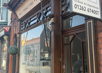 Entrance of Kelly at No92 Hair and Beauty in Bridlington, England, GB with vintage decor.