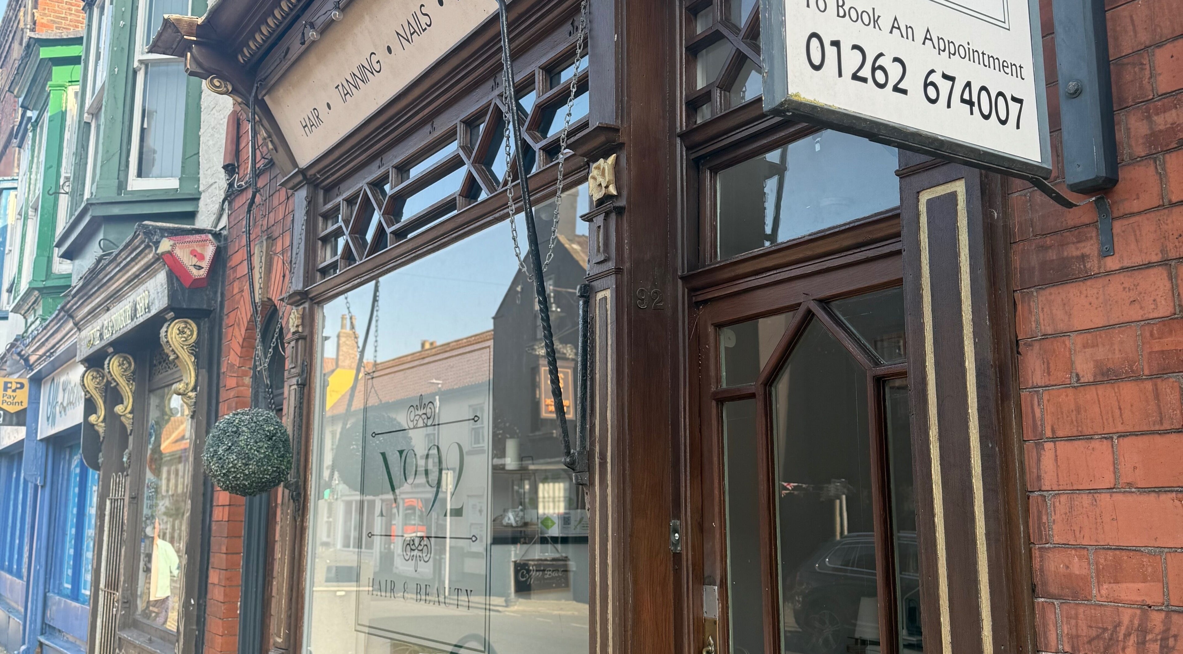 Entrance of Kelly at No92 Hair and Beauty in Bridlington, England, GB with vintage decor.