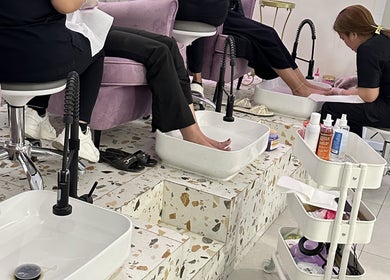 Relaxing pedicure session at Purple Nail Spa in Riyadh, Riyadh Province, SA, with clients being pampered.