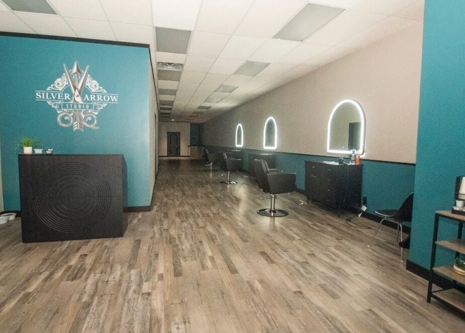 Interior view of Tasha Foster - Silver Arrow Studio in Dixon, Illinois, US with modern salon stations.
