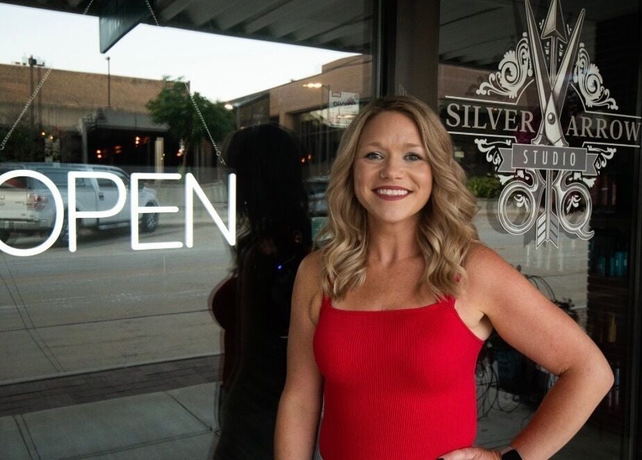 Tasha Foster welcomes you to Silver Arrow Studio in Dixon, Illinois, US, with an inviting open sign.