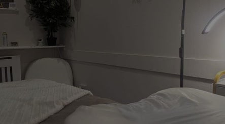 Relaxing therapy room at Pro-Motion Sports Therapy, Crawley, England, GB, with cozy lighting and decor.