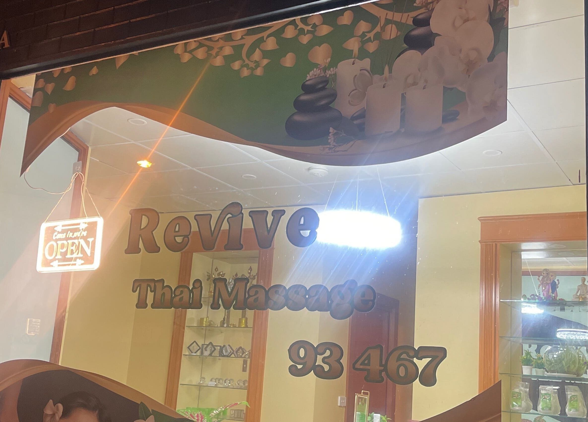 Front view of Revive Thai Massage with glowing open sign in Eastwood, South Australia, AU.