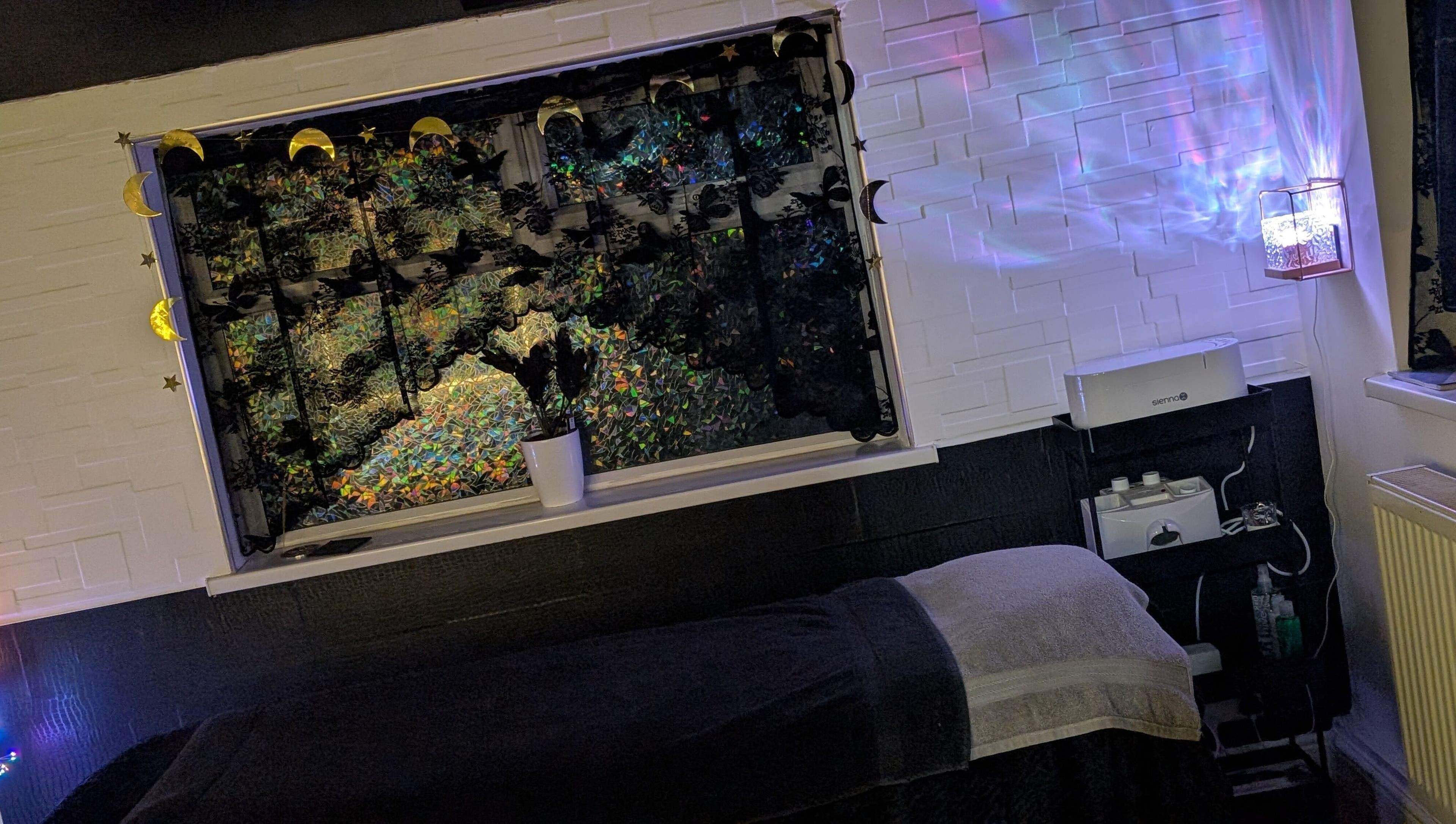 Relaxing treatment room at Beauty at the Beestons, Newcastle-under-Lyme, England, GB with soothing decor.