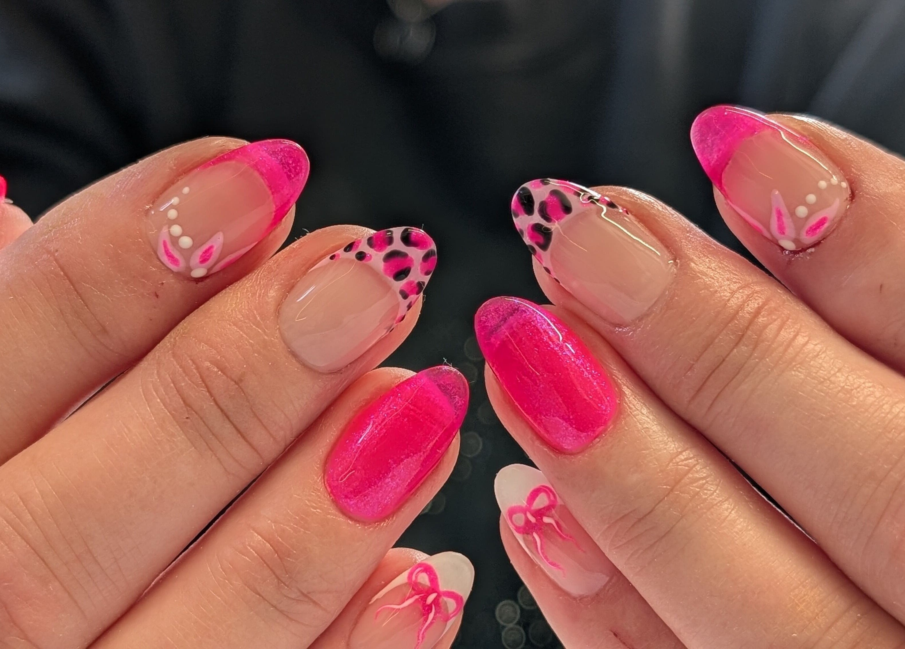 Vibrant pink and animal print nails at Beauty at the Beestons, Newcastle-under-lyme, England, GB.
