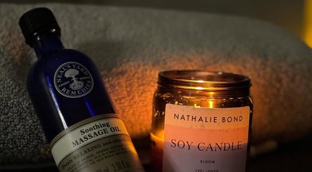 Relaxing atmosphere at The Laser Room Ramsbottom, Bury, England, with massage oil and soy candle.