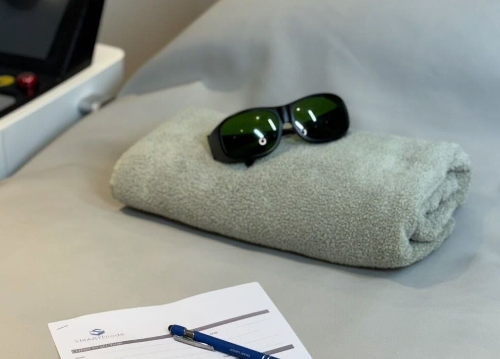 A rolled towel and safety goggles at The Laser Room Ramsbottom, Bury, England, GB ready for treatment.