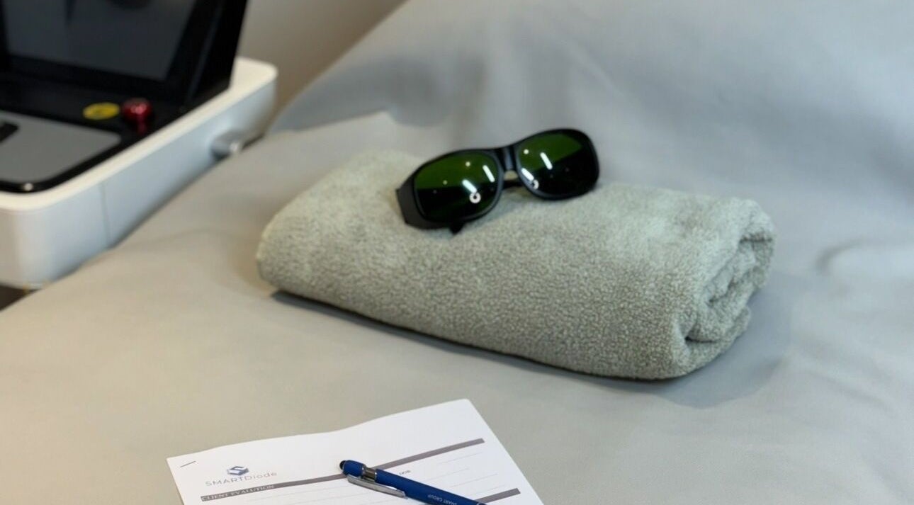 A rolled towel and safety goggles at The Laser Room Ramsbottom, Bury, England, GB ready for treatment.