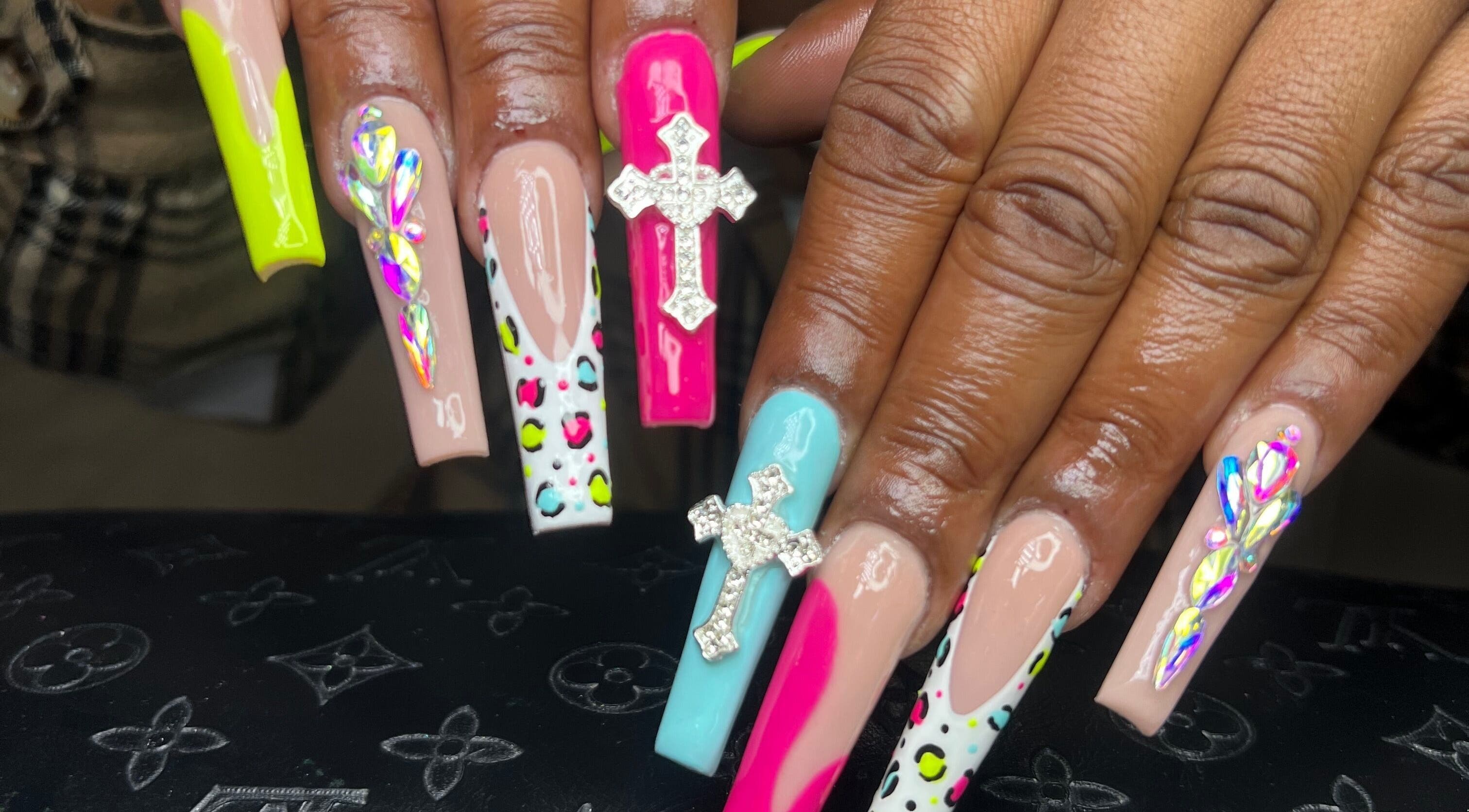 Intricate nail art with vibrant colors and gems at Raveen at Bare Skin&Spa, Columbia, South Carolina, US.