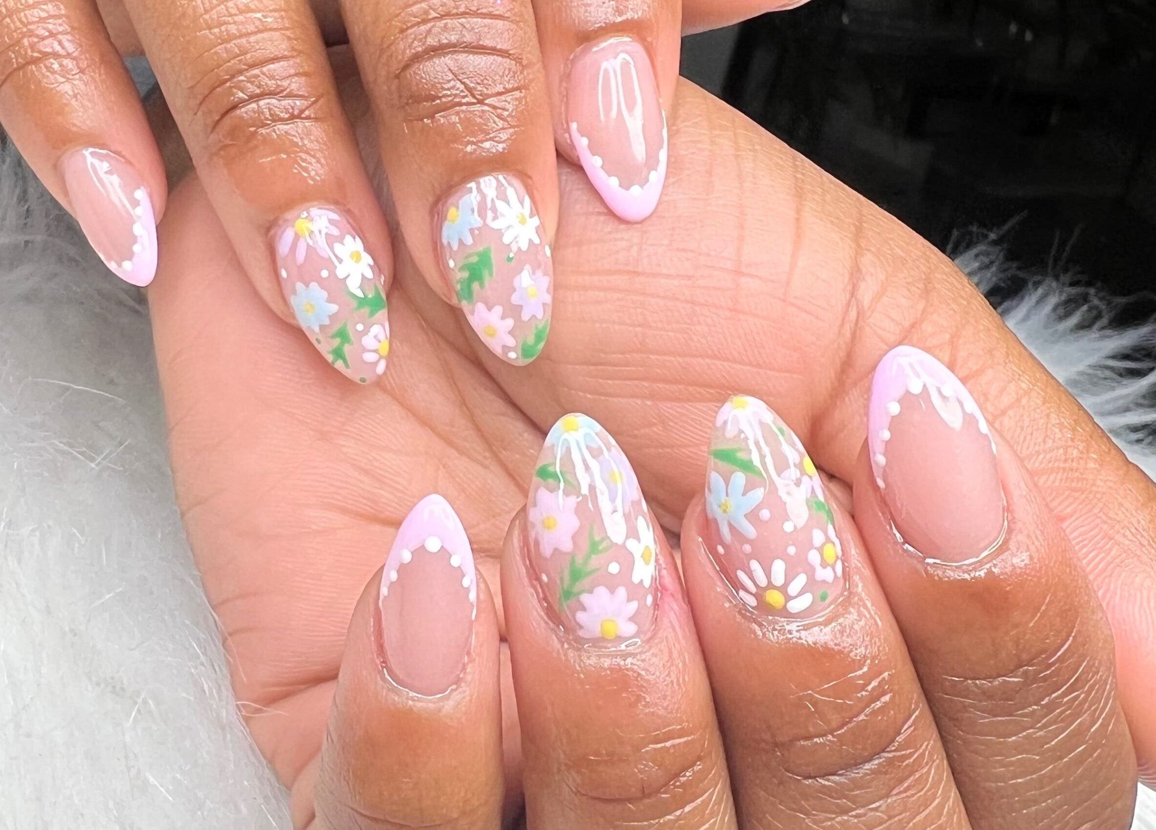 Elegant floral nail art at Raveen at Bare Skin&Spa, Columbia, South Carolina, US.