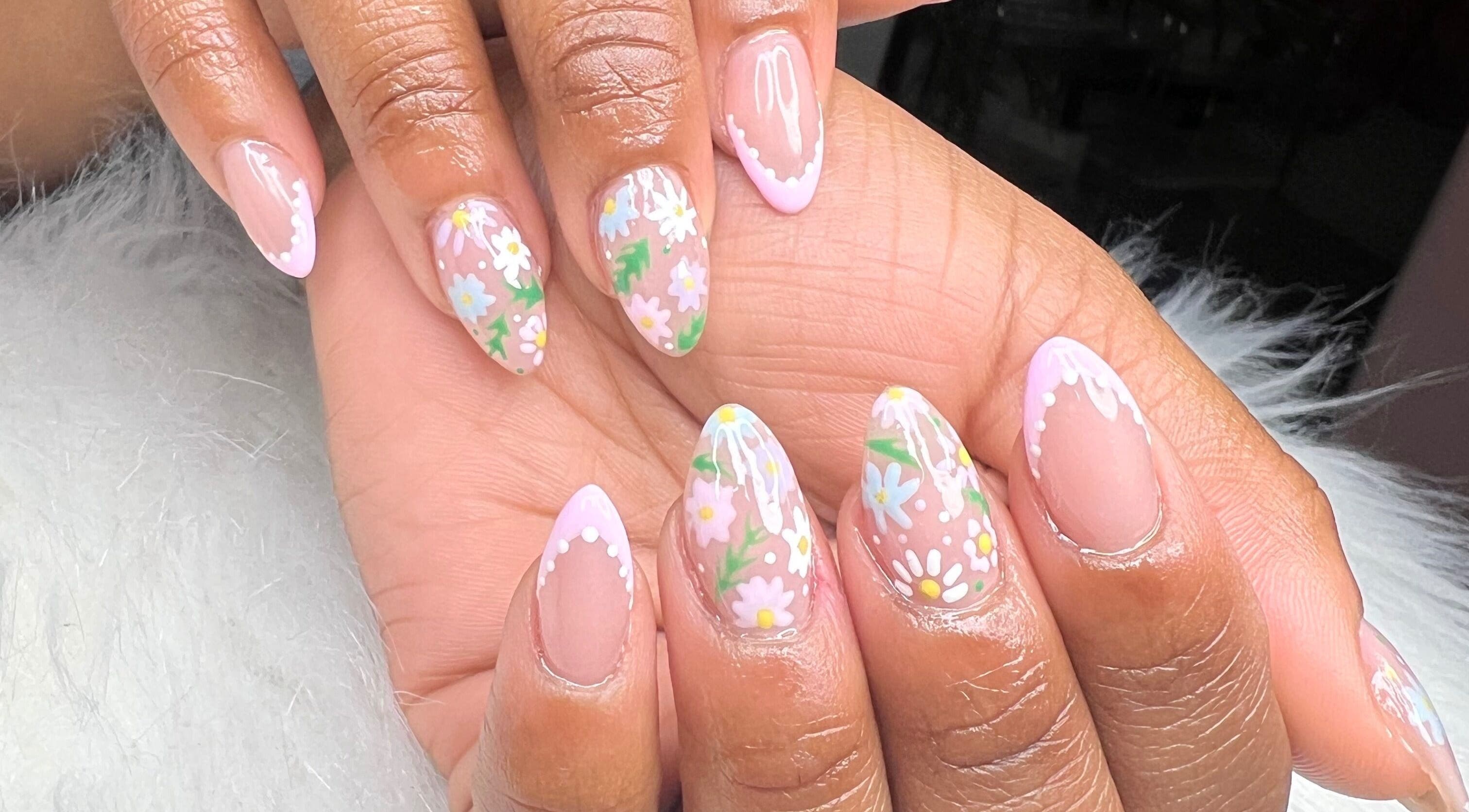 Elegant floral nail art at Raveen at Bare Skin&Spa, Columbia, South Carolina, US.