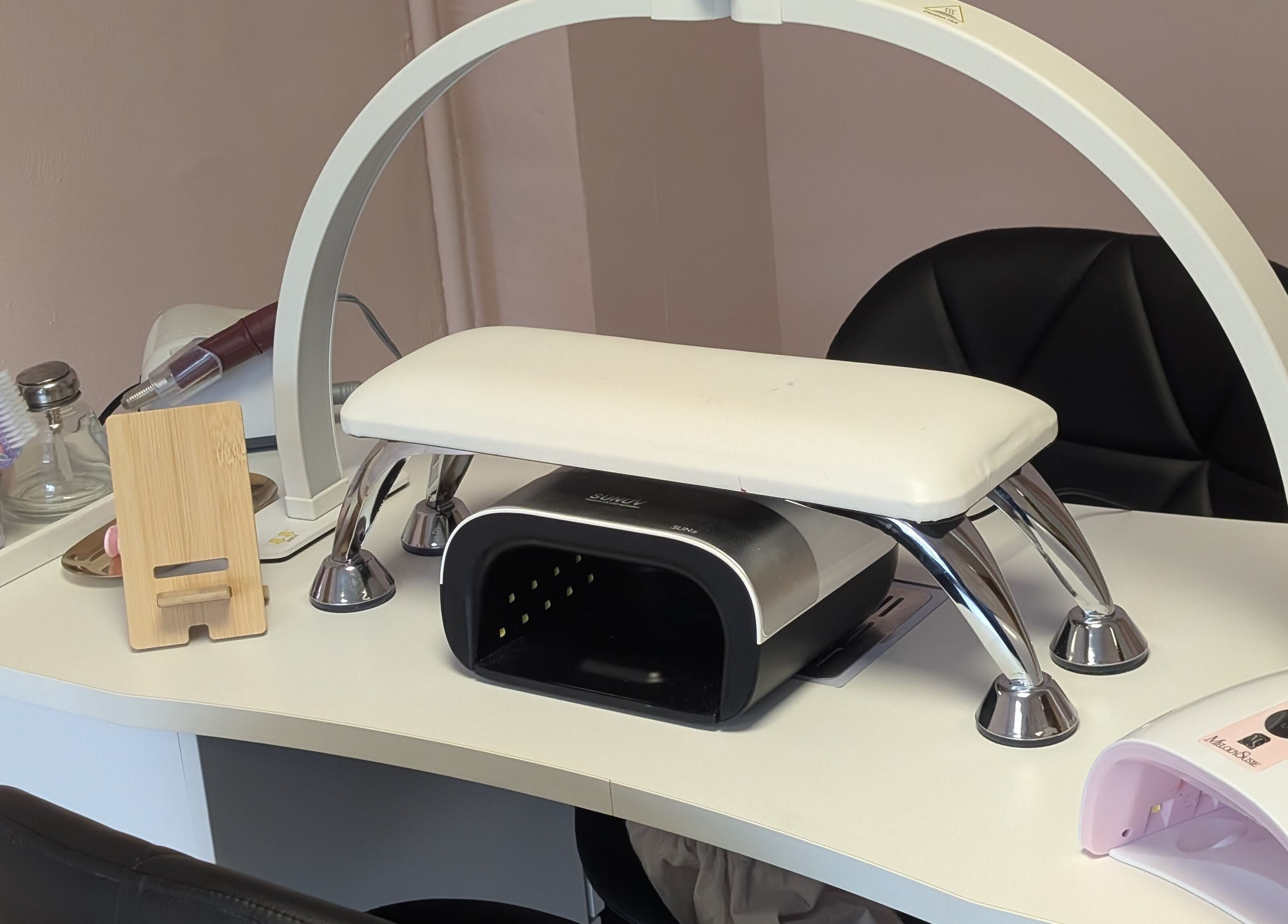 Manicure station with tools at Ona, Tonna, Wales, GB, showcasing a clean and welcoming nail salon setup.