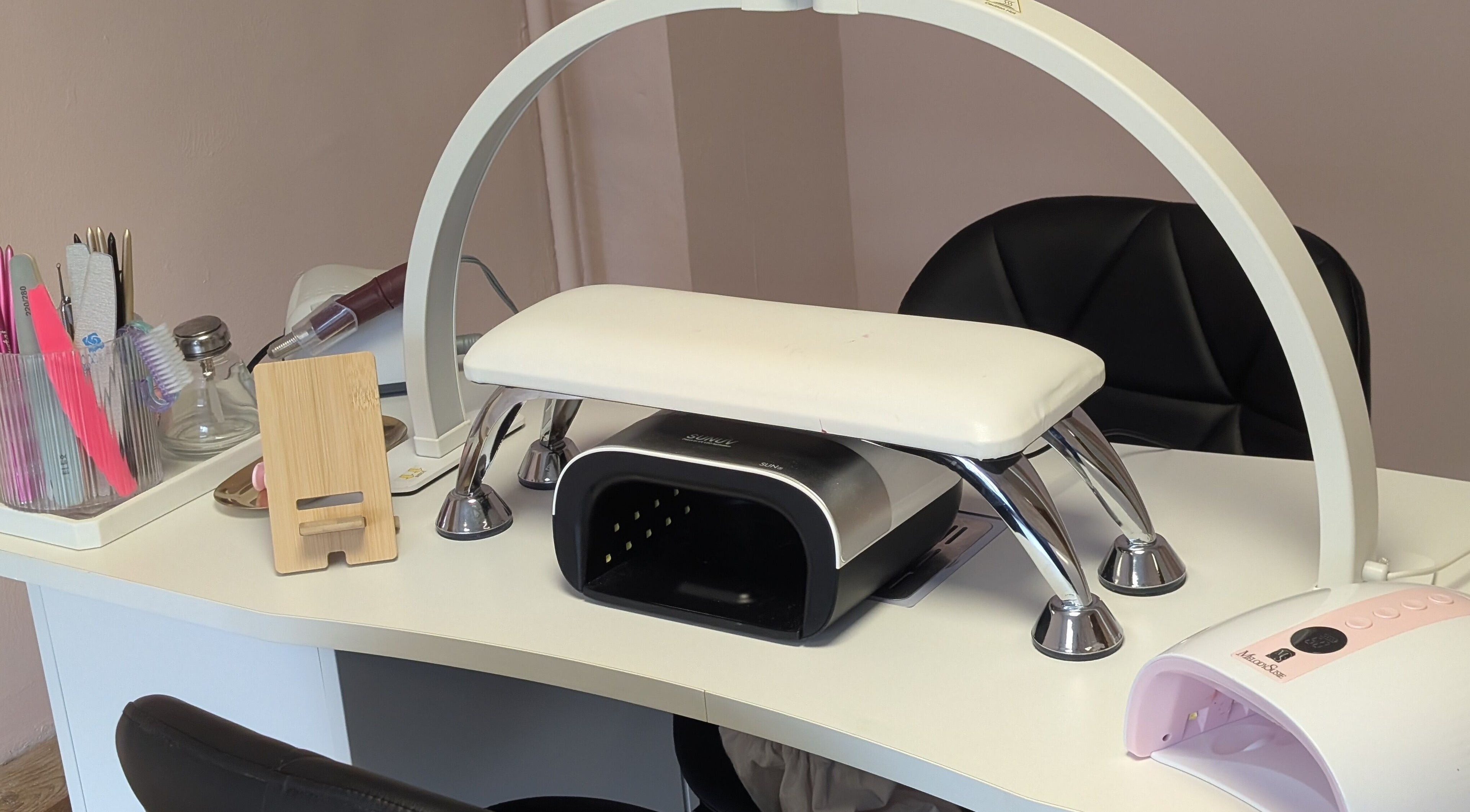 Manicure station with tools at Ona, Tonna, Wales, GB, showcasing a clean and welcoming nail salon setup.