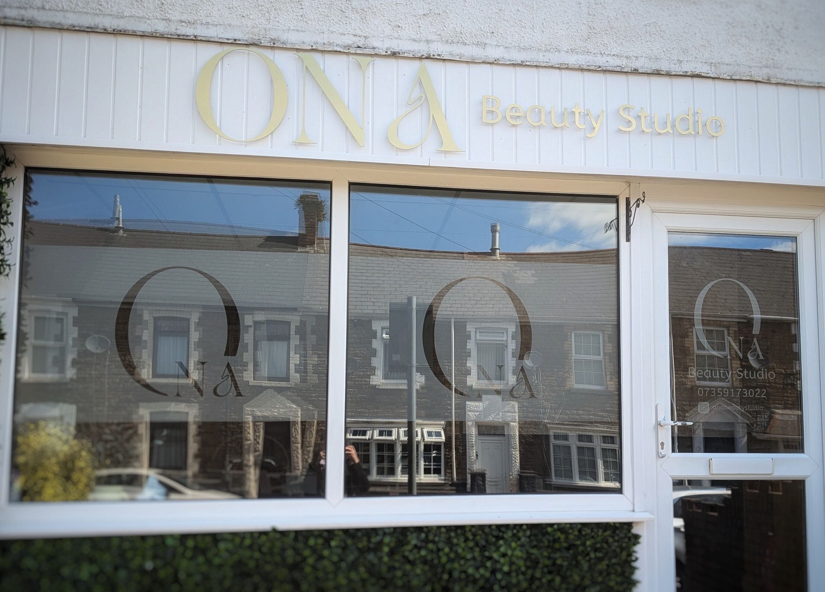Ona Beauty Studio exterior in Tonna, Wales, GB, featuring stylish signage and welcoming glass doors.