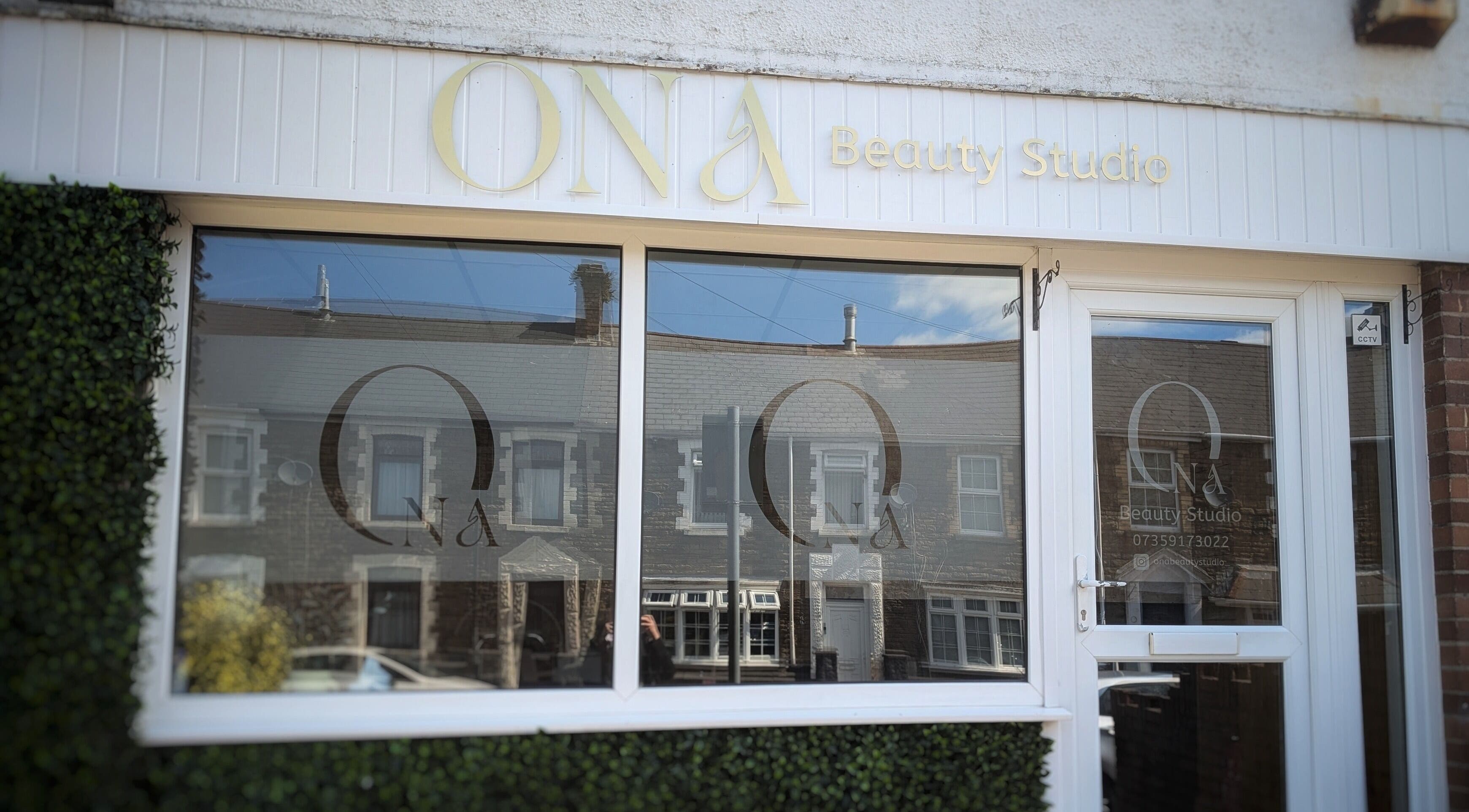 Ona Beauty Studio exterior in Tonna, Wales, GB, featuring stylish signage and welcoming glass doors.