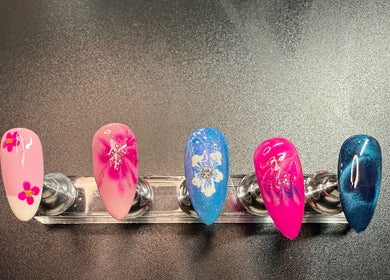 Elegant nail art designs on display at Delilah May Beauty, England, GB, showcasing vibrant and intricate styles.