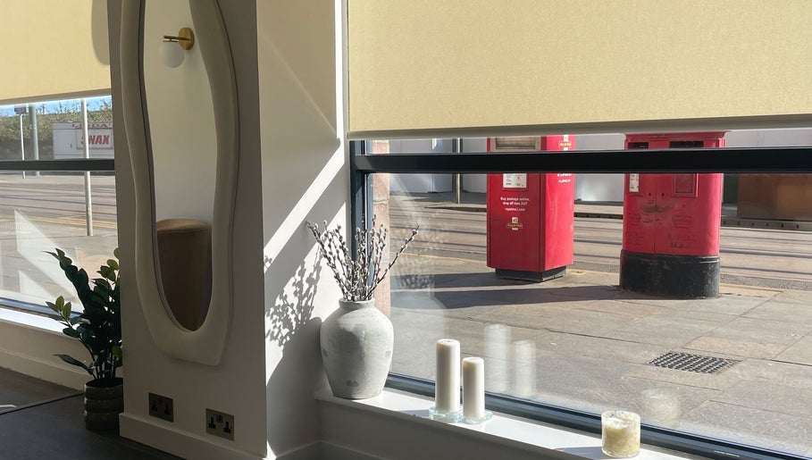 Tranquil window view at Uplift Beauty, Edinburgh, Scotland, GB with elegant decor and soft lighting.