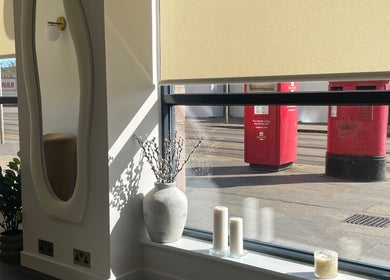 Tranquil window view at Uplift Beauty, Edinburgh, Scotland, GB with elegant decor and soft lighting.