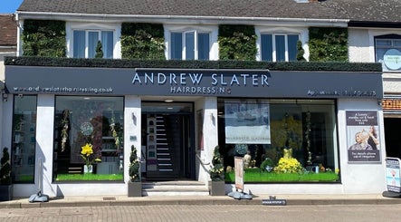 Modern facade of Beauty Magic in Malvern, England. Stylish signage above a lush, green storefront.