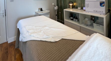 Relaxing massage room at Libertys Wellness Retreat, Melton Mowbray, England, GB, with plush treatment bed.