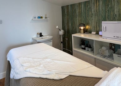 Serene spa room at Libertys Wellness Retreat in Melton Mowbray, England, GB with massage table and relaxing decor.