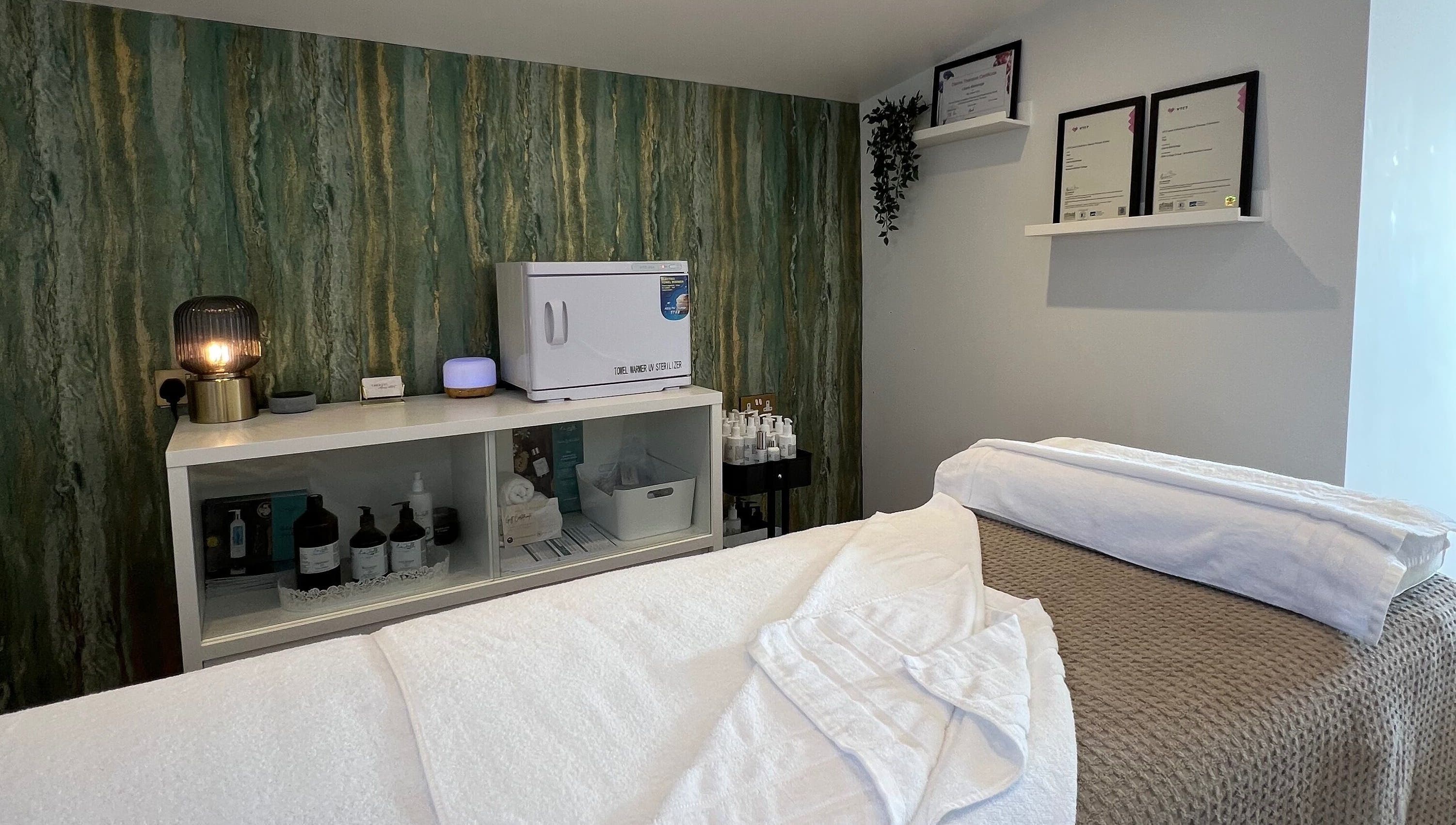 Calm treatment room at Libertys Wellness Retreat in Melton Mowbray, England, GB with cozy towels and products.
