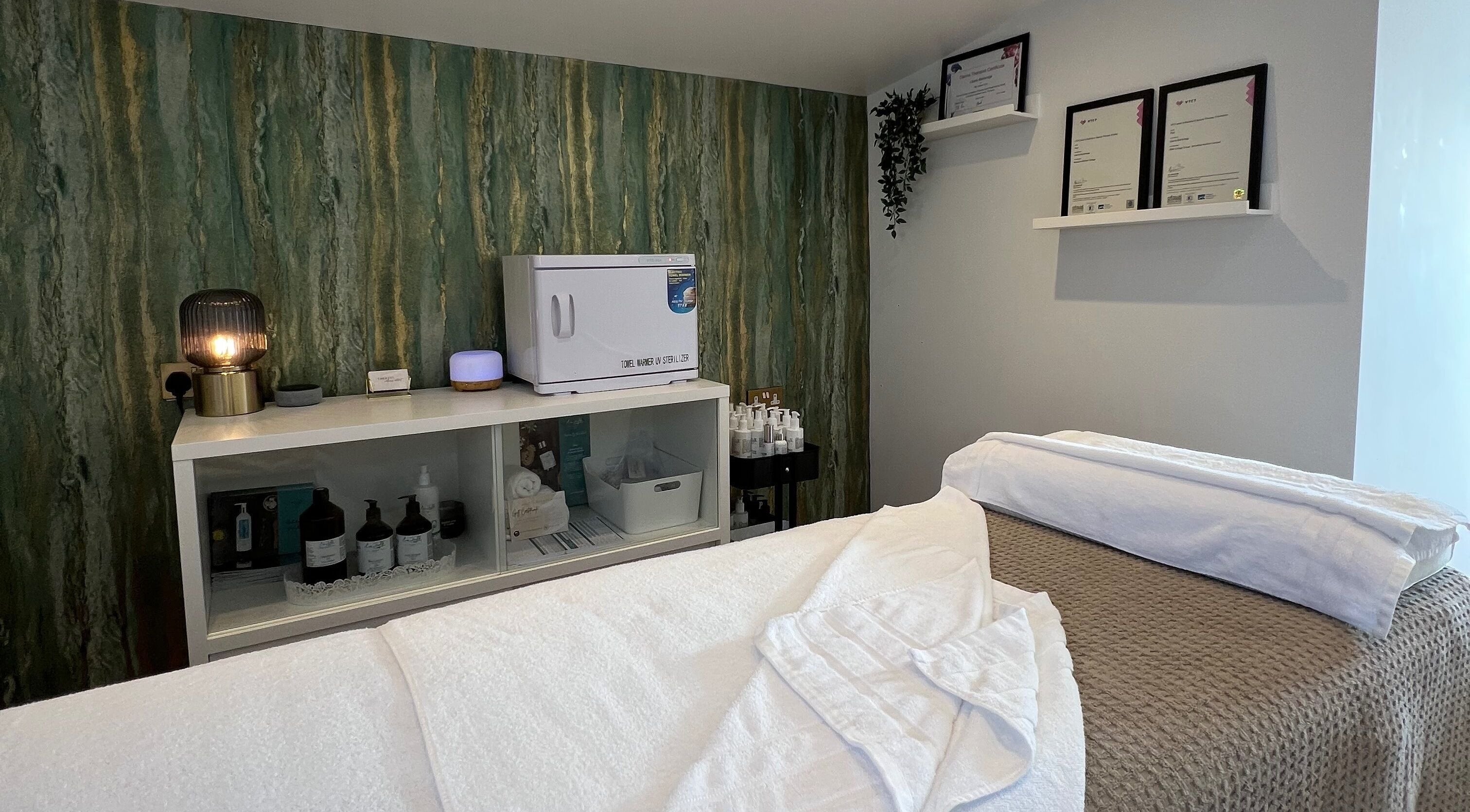 Calm treatment room at Libertys Wellness Retreat in Melton Mowbray, England, GB with cozy towels and products.
