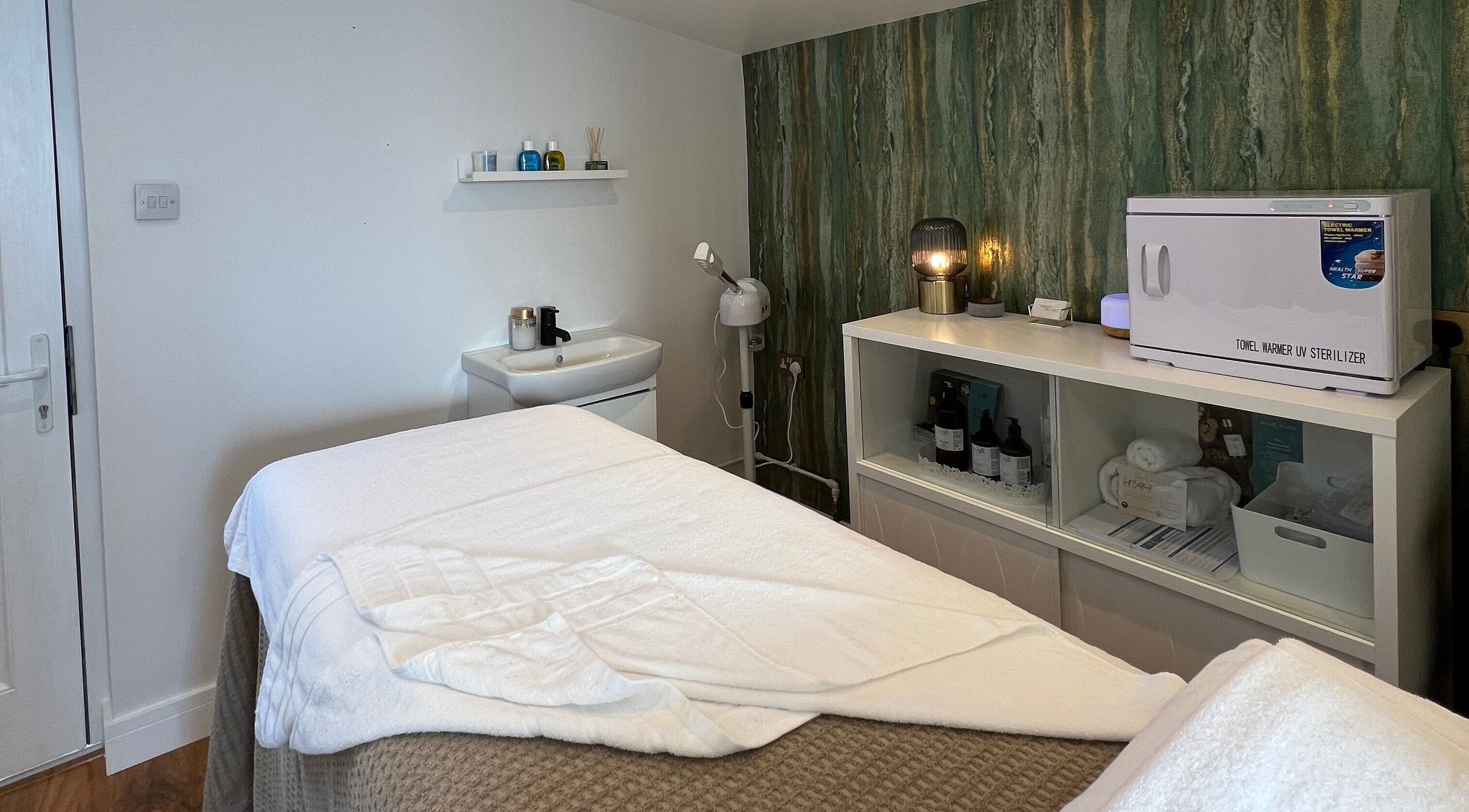 Peaceful therapy room at Libertys Wellness Retreat, Melton Mowbray, England, GB, featuring a massage table.