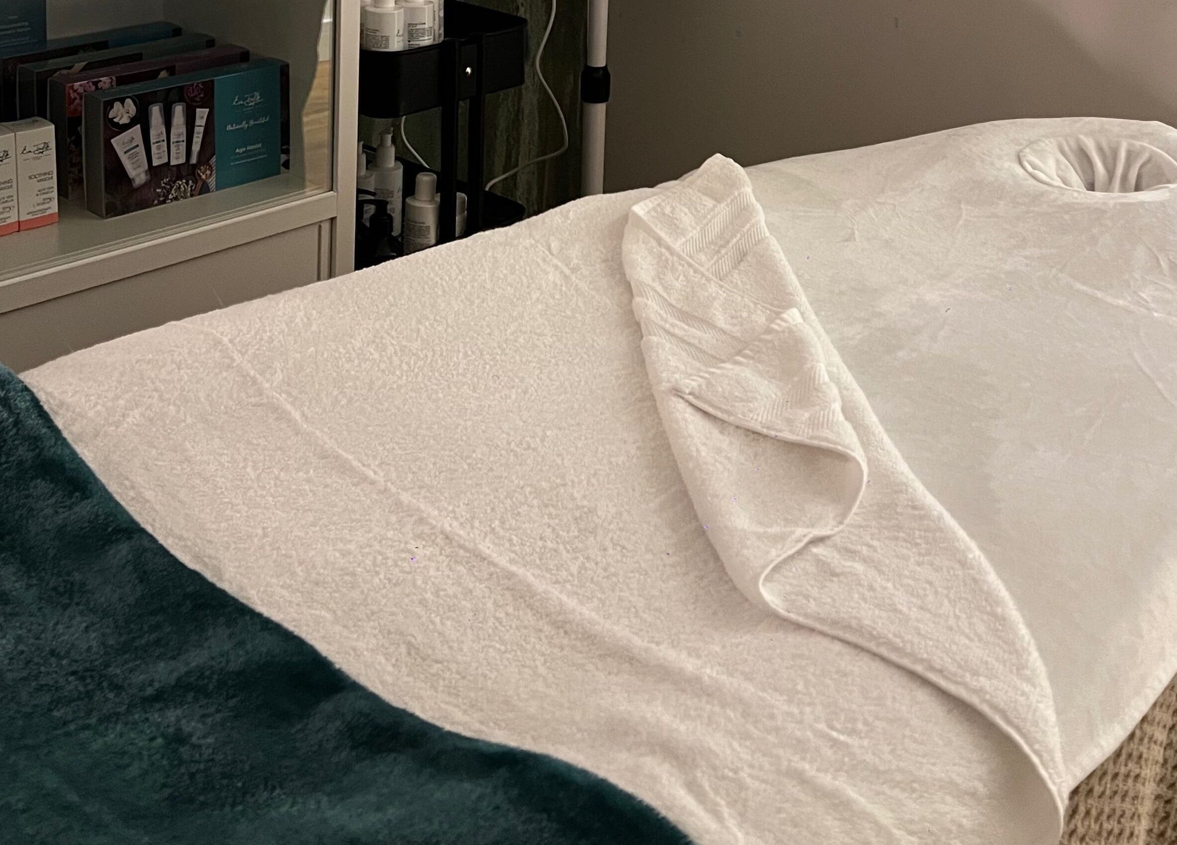 Relaxing treatment room at Libertys Wellness Retreat, Melton Mowbray, England, GB, featuring a plush massage bed.