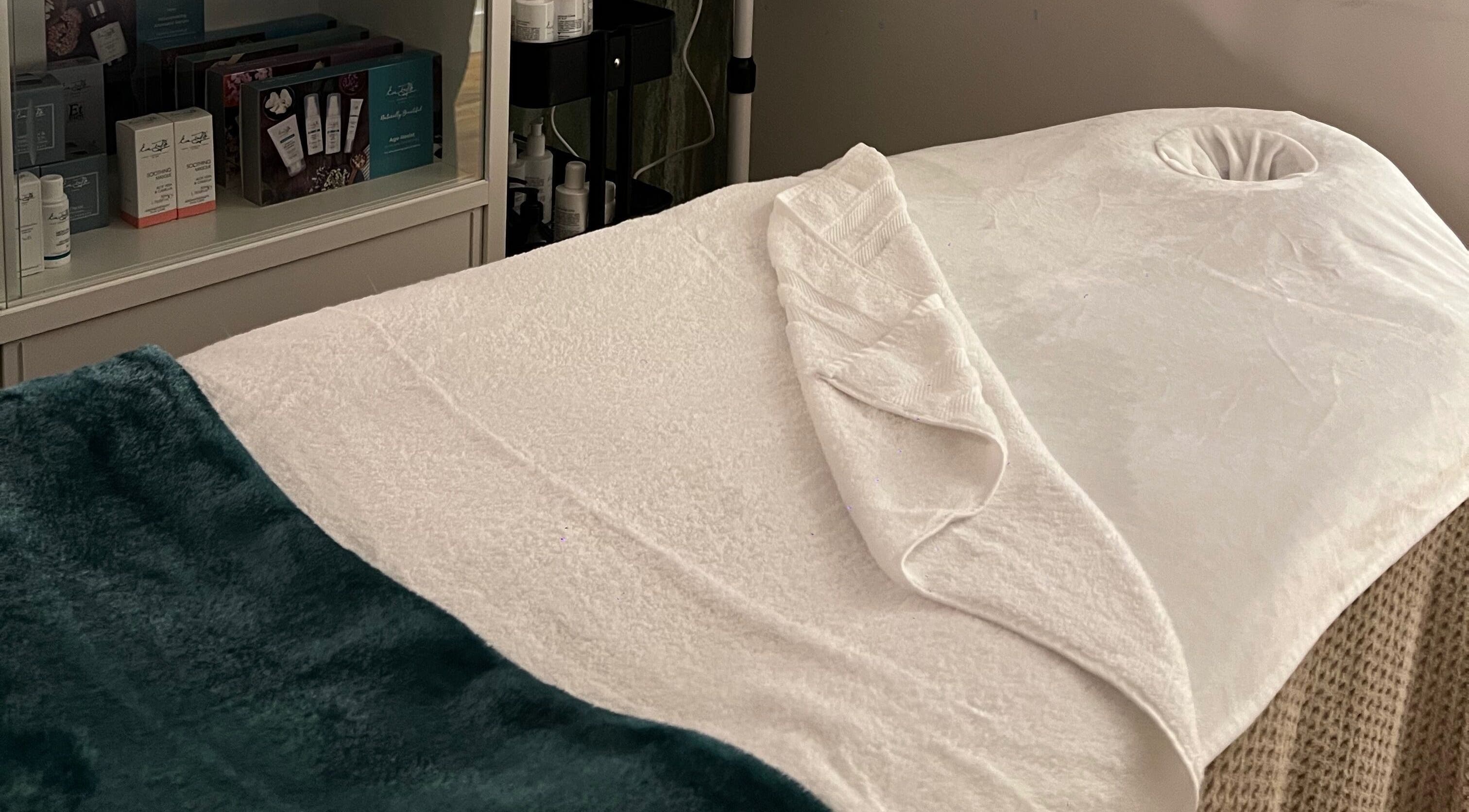 Relaxing treatment room at Libertys Wellness Retreat, Melton Mowbray, England, GB, featuring a plush massage bed.