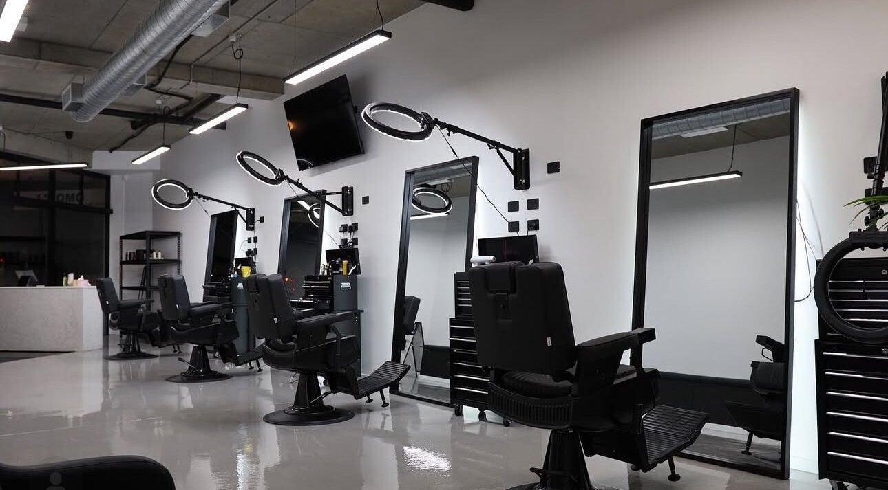 Modern barber chairs and mirrors at Elevate Barber Studio in Stanmore, New South Wales, AU.
