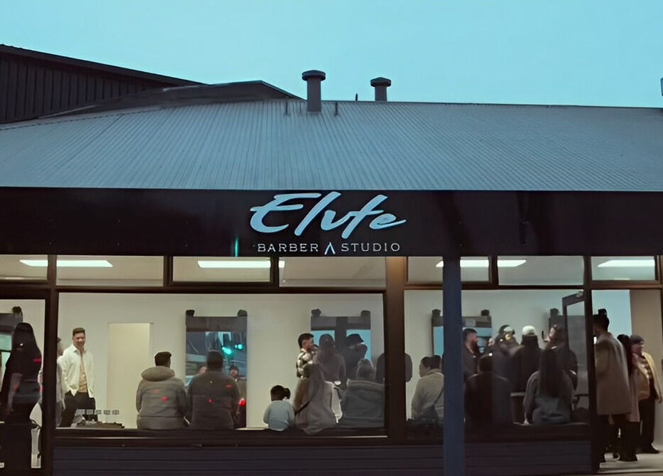 Evening view of Elevate Barber Studio in Stanmore, New South Wales, AU, bustling with patrons.